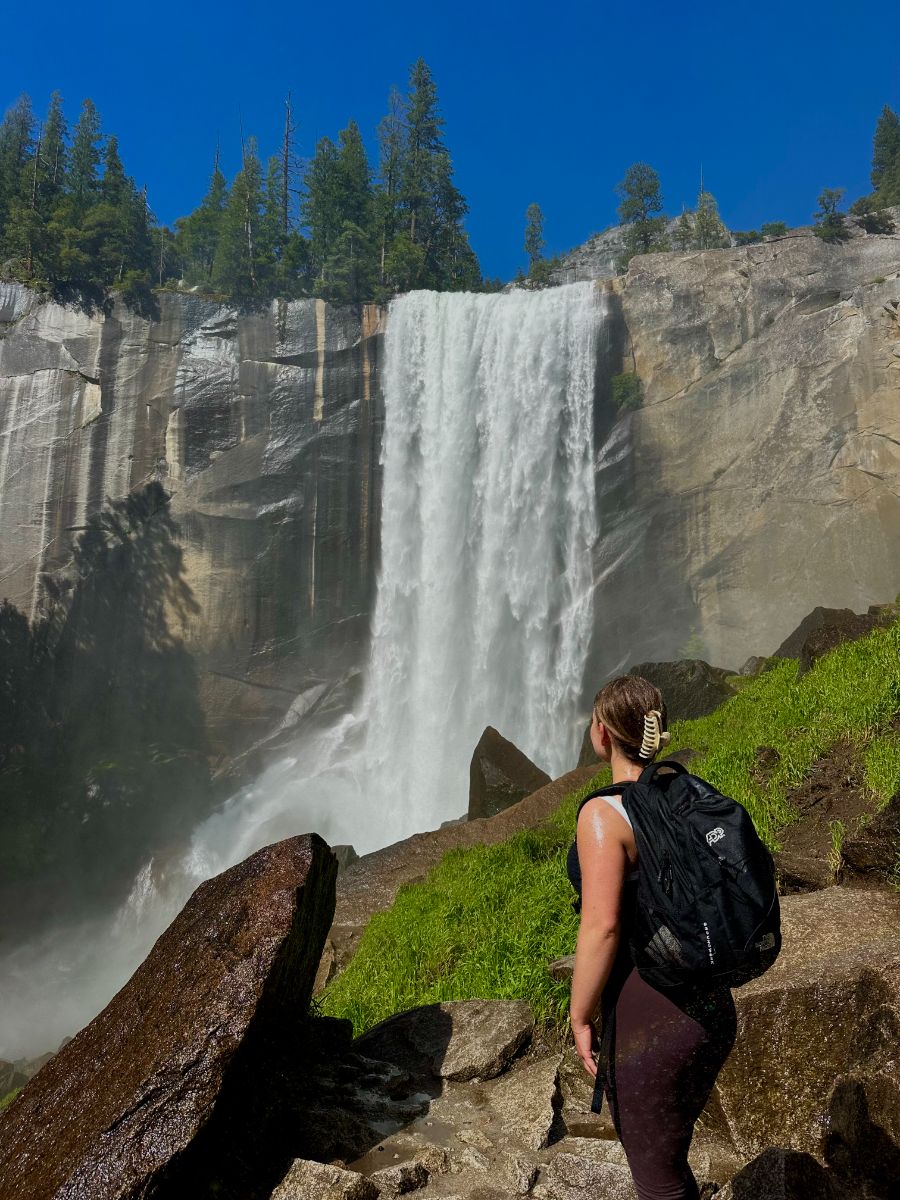 Selina hiking at a waterfall in Yosemite